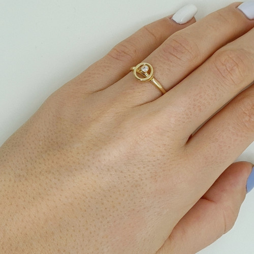 Golden ring with zircon