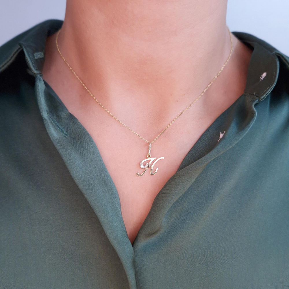 Auksinis  pakabukas „Raidė“