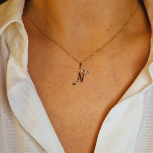 Gold pendant with zircon