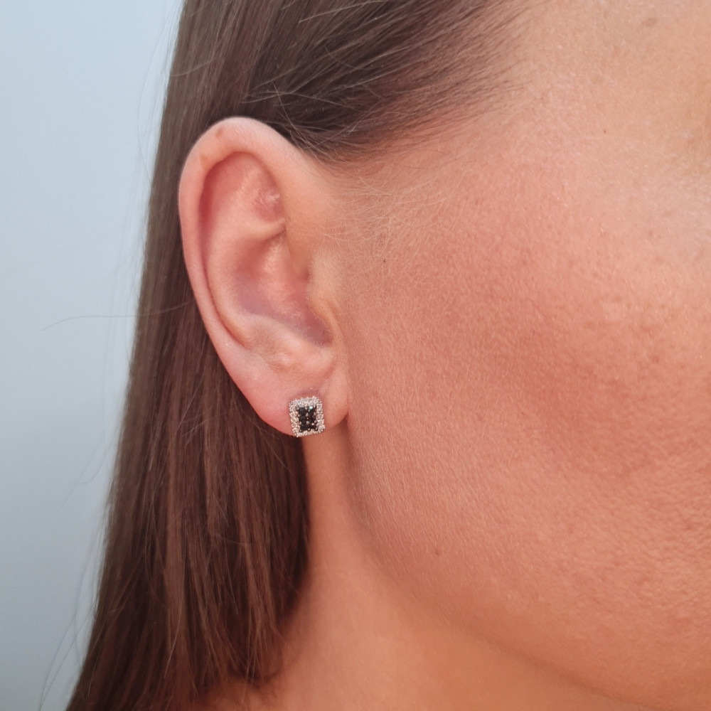 Gold earrings with a black diamond