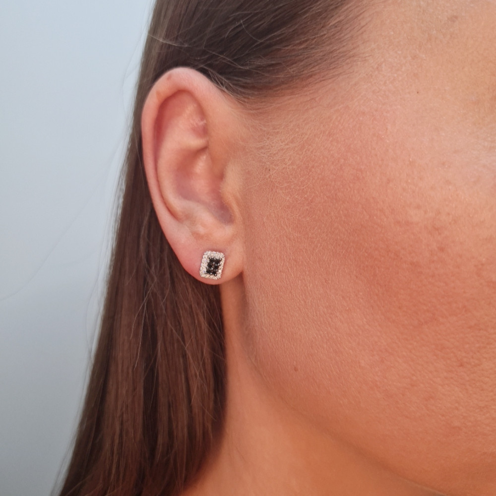 Gold earrings with a black diamond