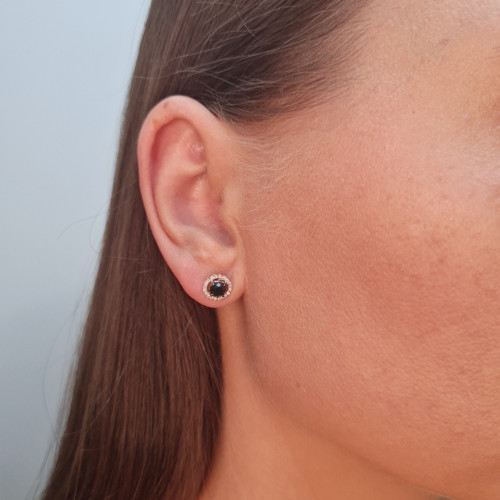 Gold earrings with a black diamond