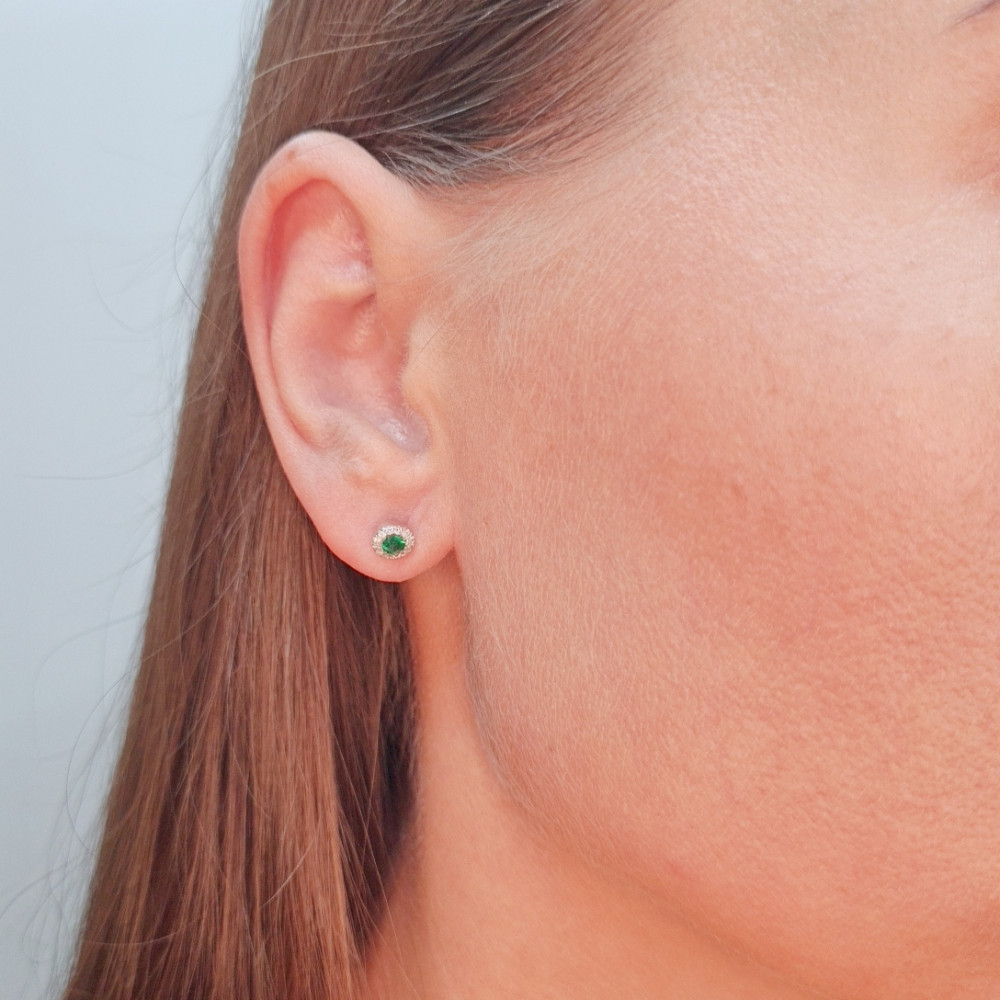 Gold earrings with emerald