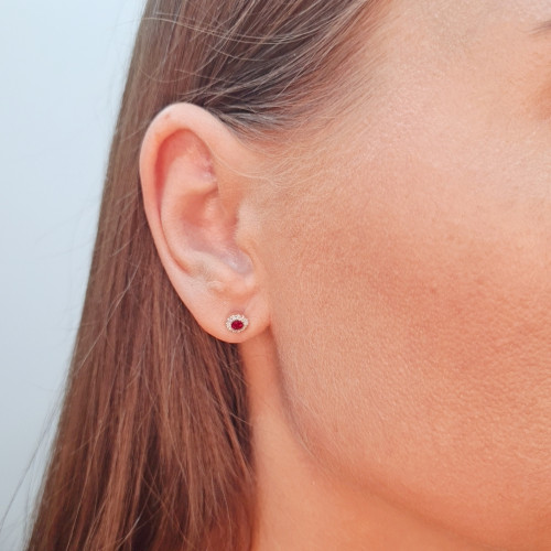 Gold earrings with a ruby