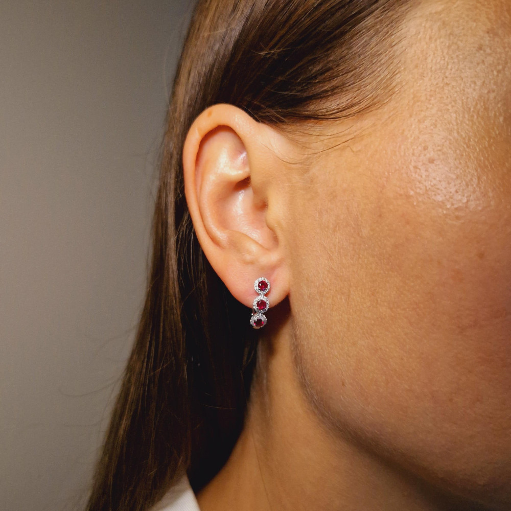 Gold earrings with a ruby