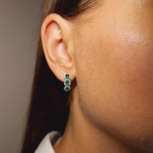 Gold earrings with emerald