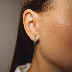 Gold earrings with emerald