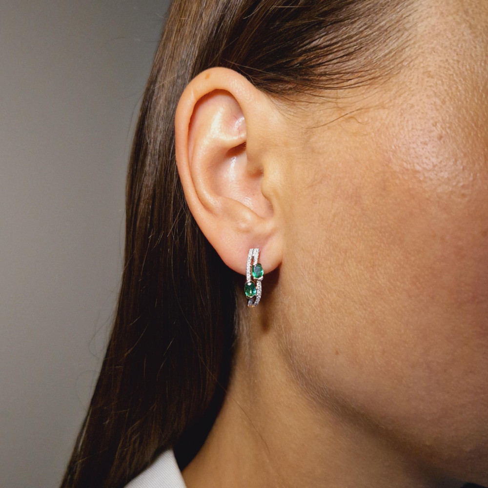 Gold earrings with emerald