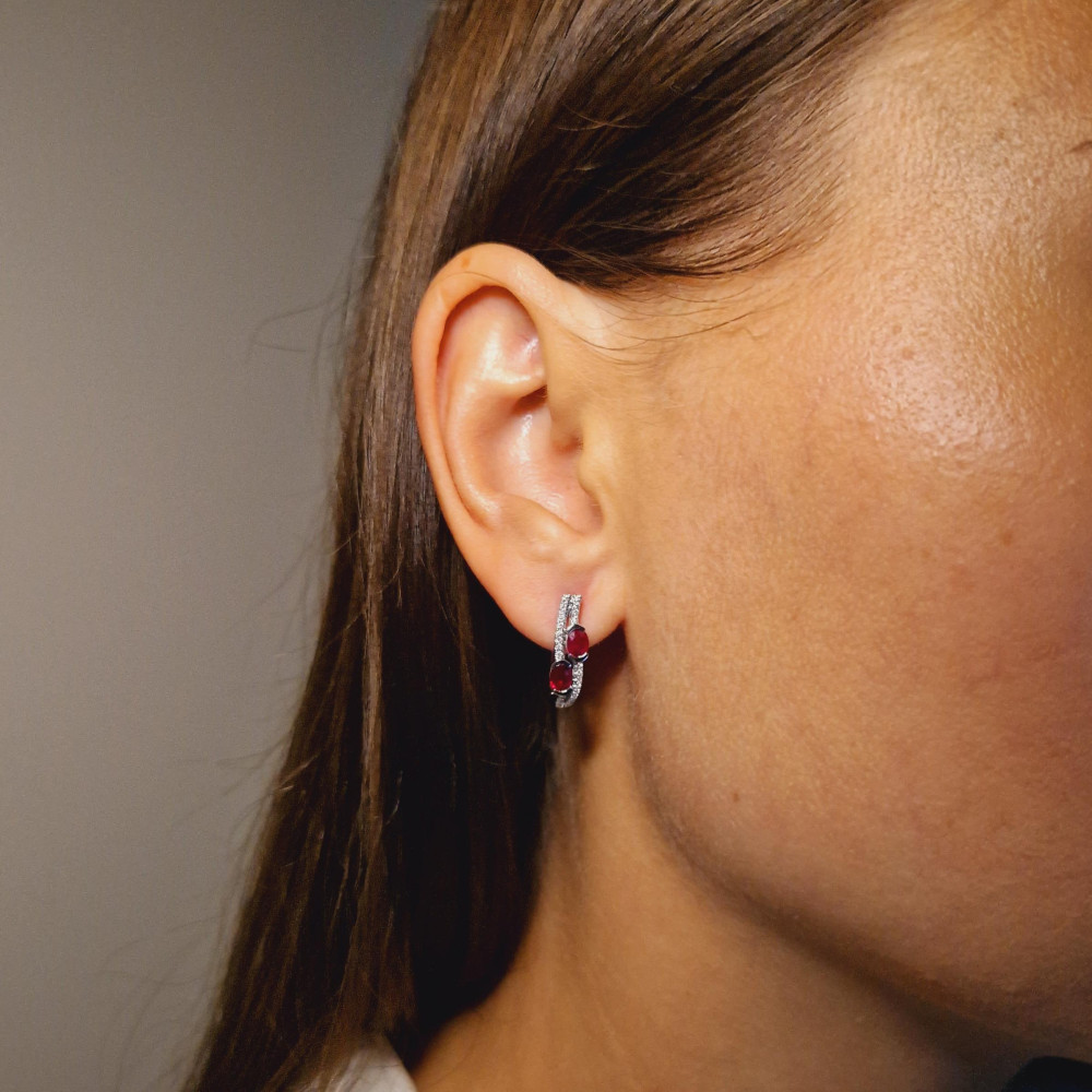 Gold earrings with a ruby