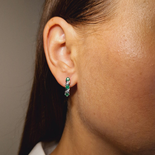 Gold earrings with emerald