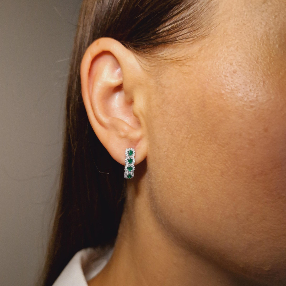 Gold earrings with emerald