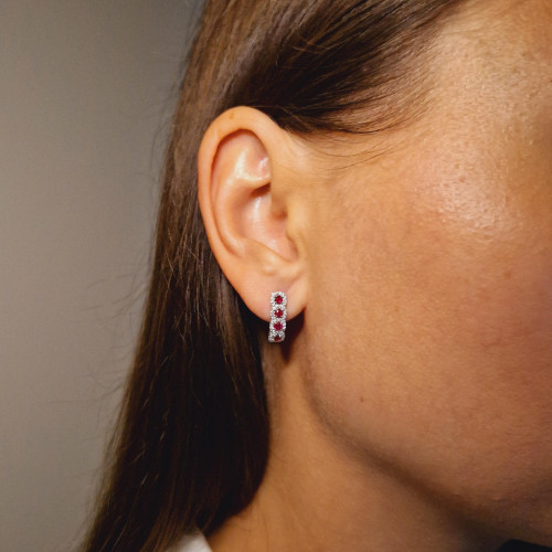 Gold earrings with a ruby