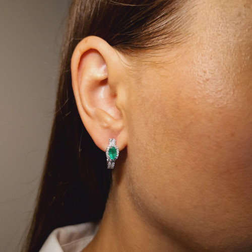 Gold earrings with emerald