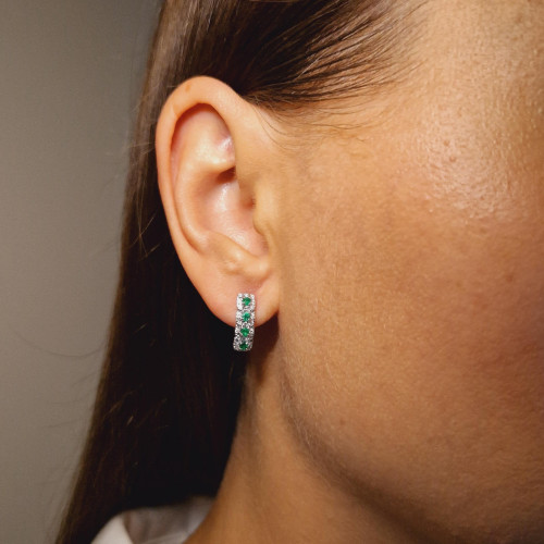 Gold earrings with emerald