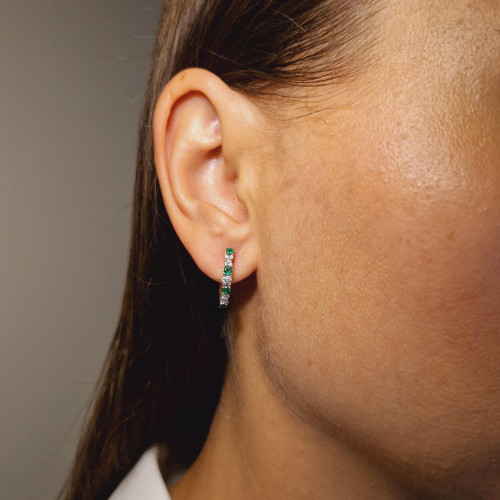 Gold earrings with emerald