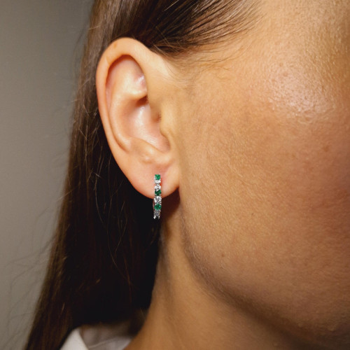 Gold earrings with emerald