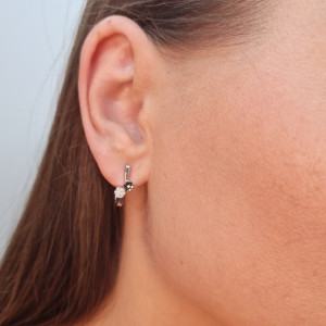 Gold earrings with a black diamond