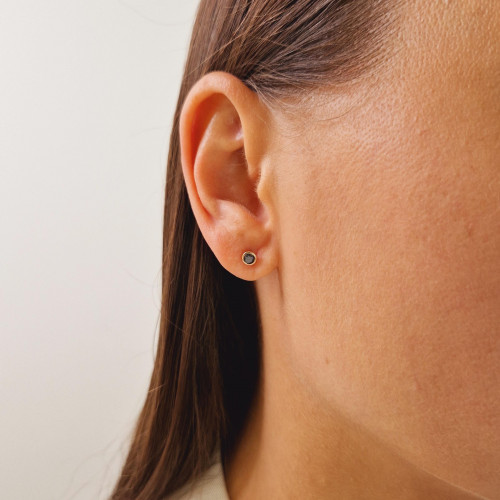 Gold earrings with a black diamond