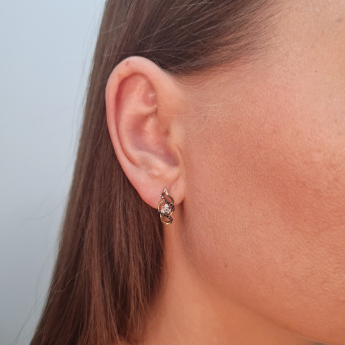 Gold earrings with a black diamond