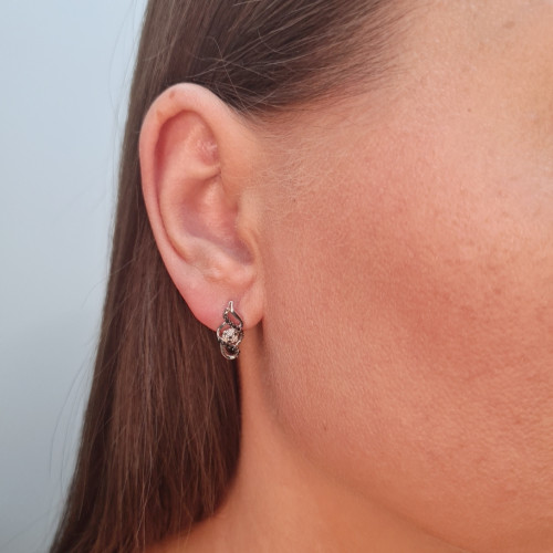 Gold earrings with a black diamond