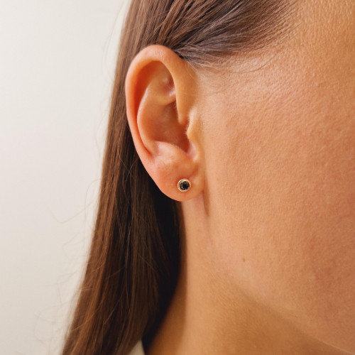 Gold earrings with a black diamond