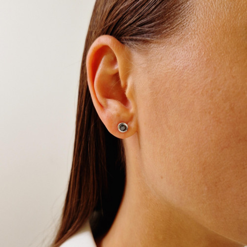 Gold earrings with a black diamond