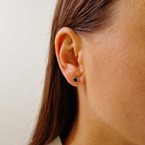 Gold earrings with a black diamond