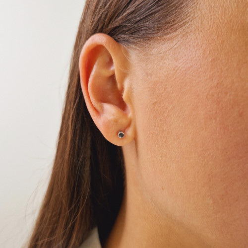 Gold earrings with a black diamond