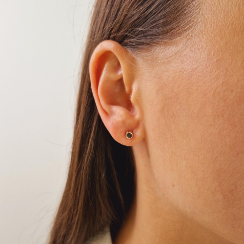 Gold earrings with a black diamond