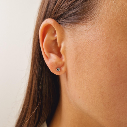 Gold earrings with a black diamond