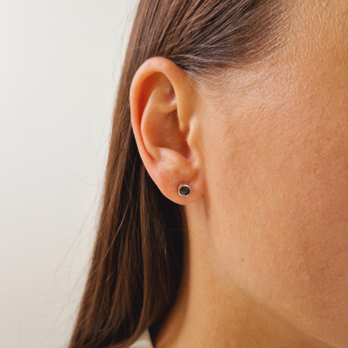 Gold earrings with a black diamond