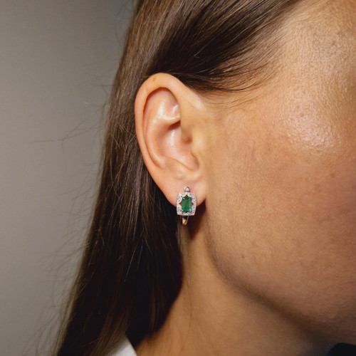 Gold earrings with emerald