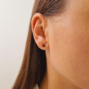 Gold earrings with a black diamond