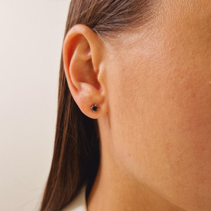 Gold earrings with a black diamond