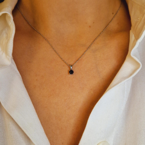 Golden pendant with precious stones