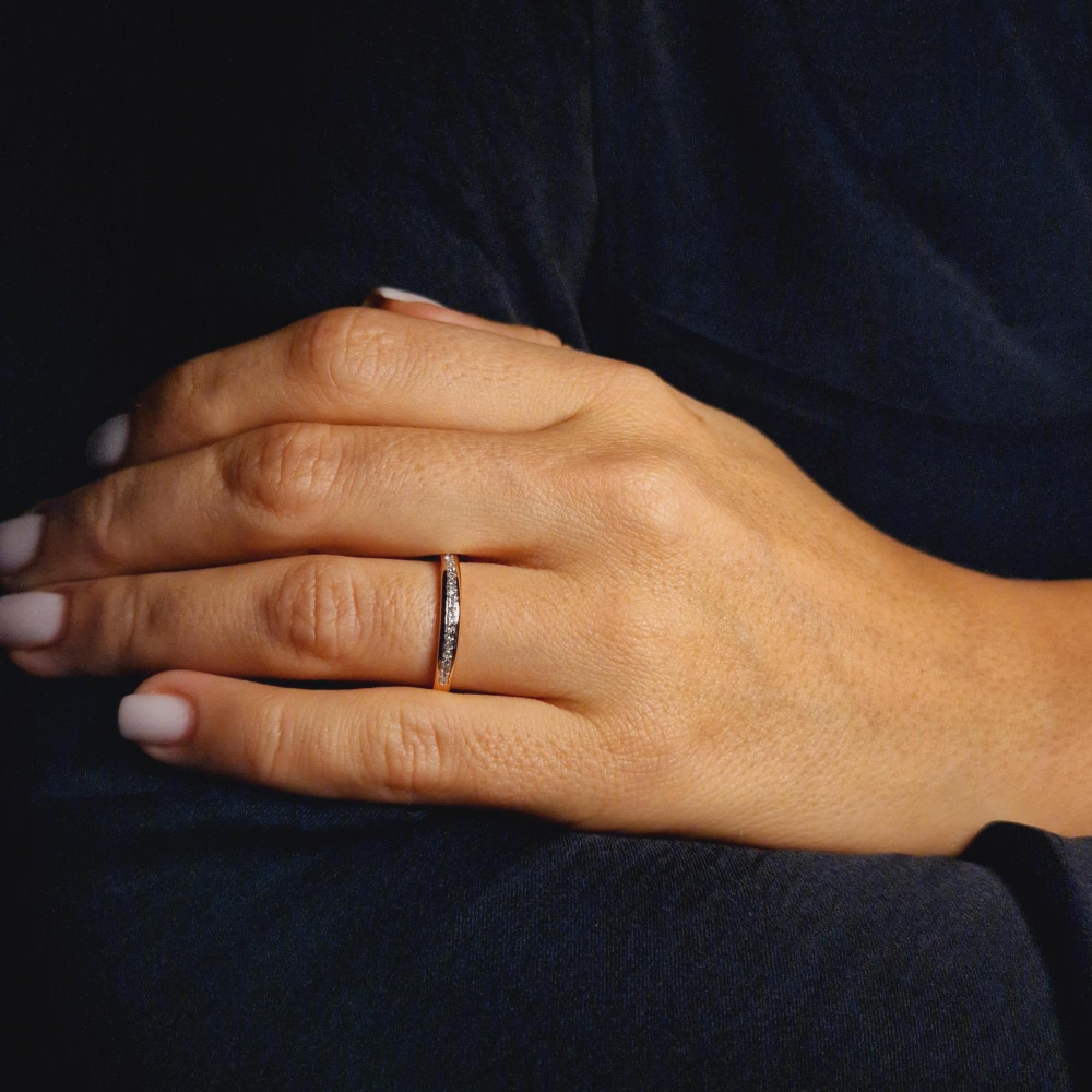 Golden ring with precious stones