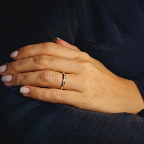 Golden ring with precious stones