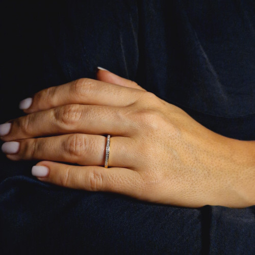 Golden ring with precious stones