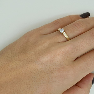 Golden ring with zircon