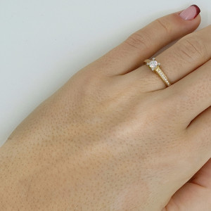 Golden ring with zircon