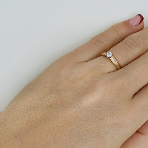Golden ring with zircon