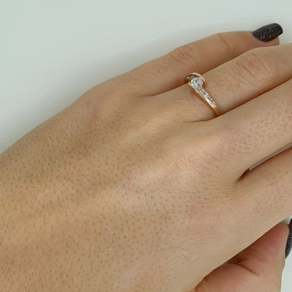 Golden ring with zircon
