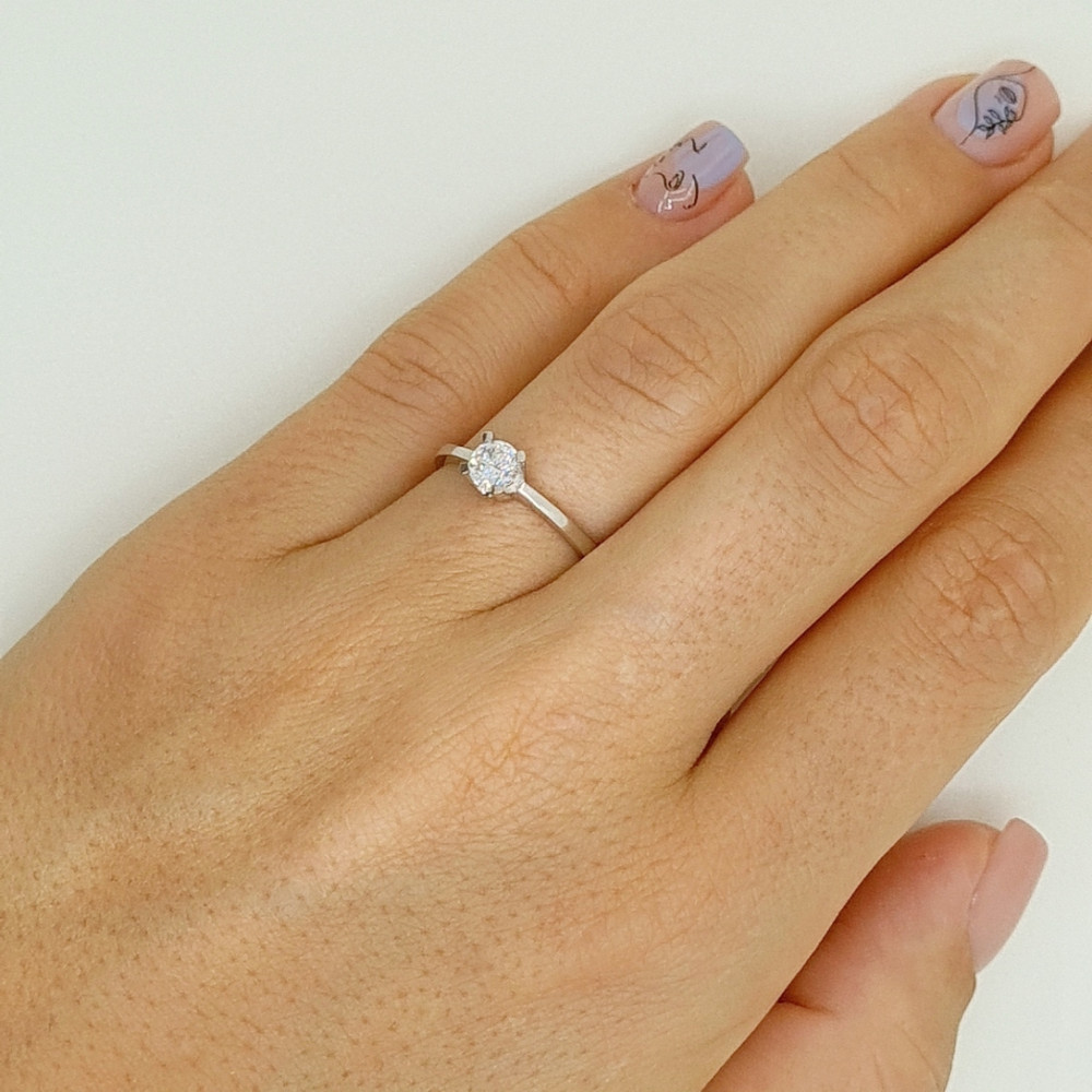 Golden ring with zircon