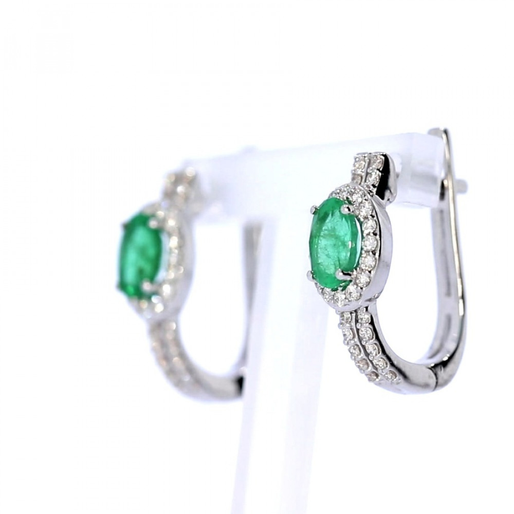 Gold earrings with emerald