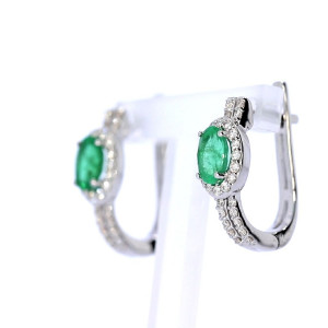 Gold earrings with emerald