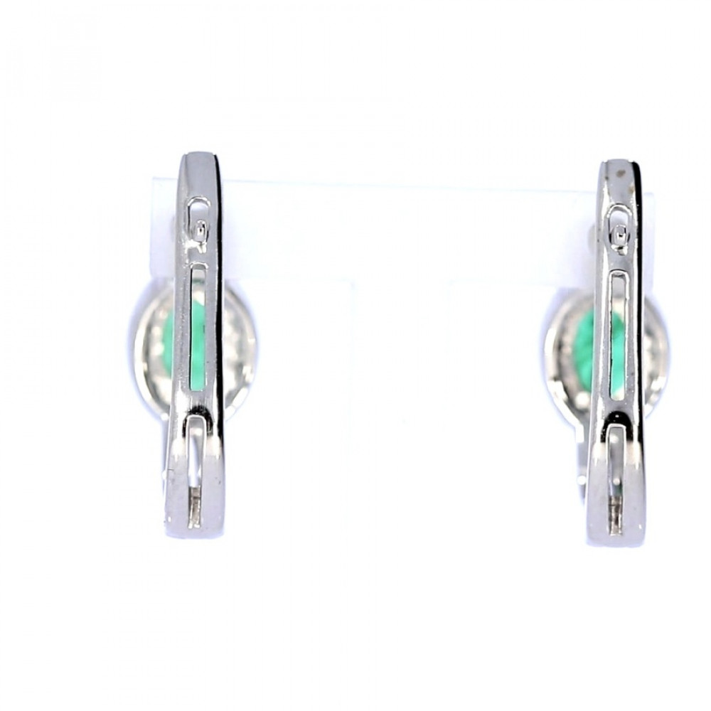 Gold earrings with emerald