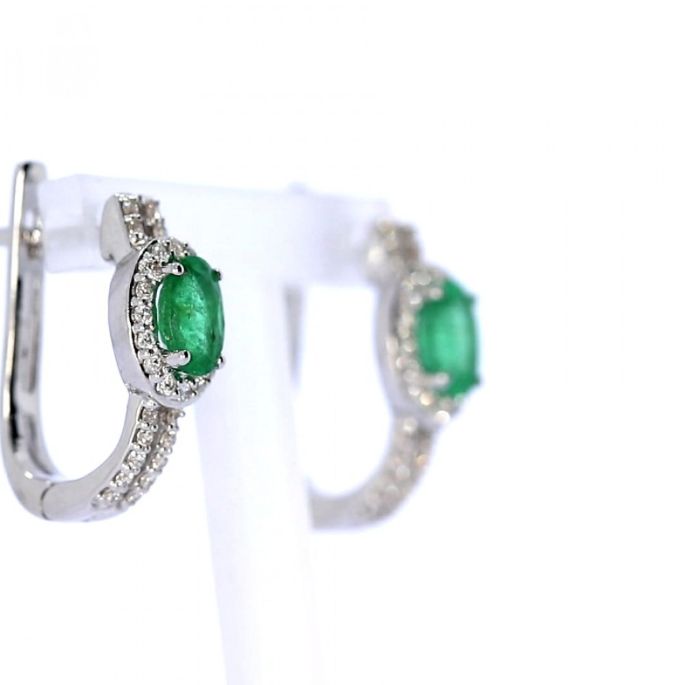 Gold earrings with emerald