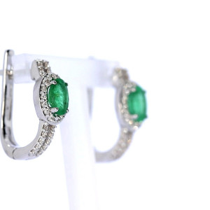 Gold earrings with emerald