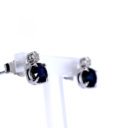 Golden earrings with precious stones