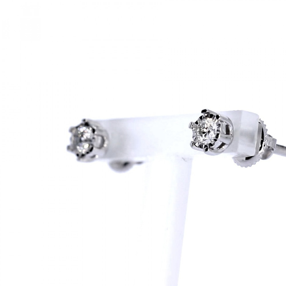 Golden earrings with precious stones